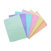 Bavoir dentaire étanche de haute qualité de qualité médicale Coussinets dentaires jetables Papier dentaire pour dentiste Coussinet de suture dentaire