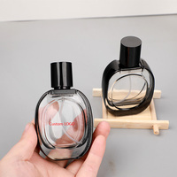 Botella de Perfume de Vidrio Ovalada de 30 ml con Borde Negro y Tapas Negras, Personalizable con la Etiqueta de su Marca