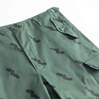 Uniforme d'entraînement tactique de sécurité tanzanien en camouflage vert Ensemble veste et pantalon de combat personnalisés pour des conditions de terrain difficiles