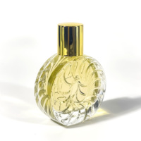 Bouteille en verre de parfum ronde en relief de haute qualité conception Unique pour huile essentielle et diffuseur 50ml emballage de boîte de Volume vide