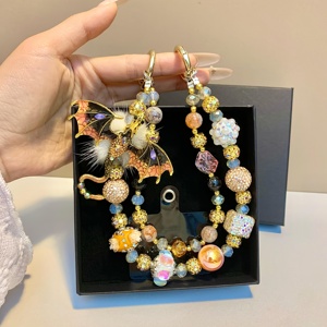 สายคล้องโทรศัพท์มือถือลายมังกรทองพรีเมียม ประดับขนนกสวยงาม ทำด้วยมือ พร้อมลูกปัด ตกแต่งกระเป๋า ใช้ได้กับโทรศัพท์ทุกรุ่น ของขวัญเครื่องประดับสำหรับเธอ - Product Image 6