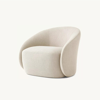 Fauteuil de luxe américain haut de gamme sur mesure en tissu bouclé crème, silhouette arrondie, pour salon, hôtel, ou salle de séjour