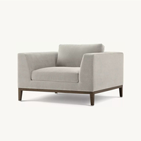 Ensemble Fauteuil et Ottoman en Tissu Texturé Gris Moderne de Luxe Français Élégant, Chaise Longue Confortable à Accoudoirs Larges et Rembourrés pour Hall d'Hôtel