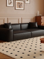 Canapé une place en tissu, style minimaliste italien, couleur crème, forme bloc de tofu, lignes droites, pour petits salons et appartements modernes