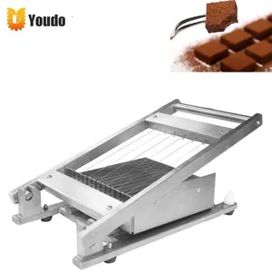 Manual Double Cutting Arm Chocolate Bar Square Grid Cake Cutting Machine  Caramel Cutter Chocolate Guitar Cutter - China Chocolate Cutting Machine,  Chocolate Slicing Machine