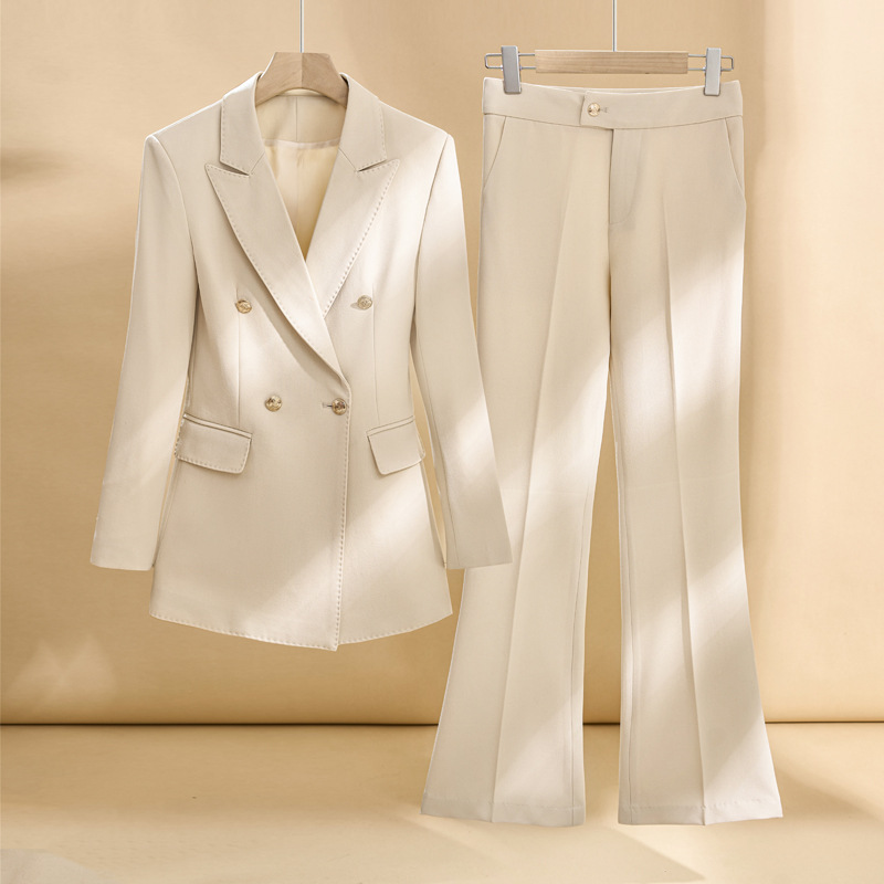 apricot-colored suit with slightly flared trousers