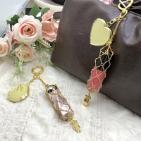 Porte-clés pliable portable en acier inoxydable doré et argenté, avec miroir ovale et pochette en maille pour rouge à lèvres, design créatif pour femme