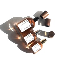 Fabricante de botellas de perfume vacías 30ml 50ml 100mL Cilindro de fragancia Botellas de vidrio redondas con tapa de madera