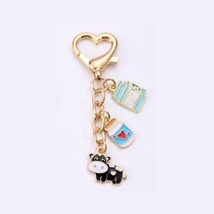 Nouveau porte-clés en alliage de zinc doré en forme de cœur pour animaux de compagnie, petit pendentif vache, accessoire de sac - Product Image 3