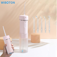 Hydropulseur dentaire mini rechargeable par USB avec 5 embouts standard et conception professionnelle étanche