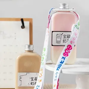 Fonte vendita diretta in fabbrica bottiglia di tè al latte 400ml PET rotonda piatta in plastica trasparente bella bottiglia per bevande con cinturino