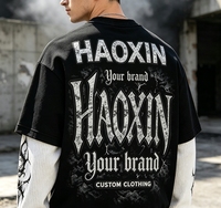 T-shirt graphique à manches longues en coton épais avec épaules tombantes, style superposé, haut tendance pour vêtements urbains masculins OEM