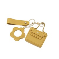Porte-clés en cuir de style mignon et tendance avec miroir, étui à rouge à lèvres, mini sac à main et pendentif pour sacs