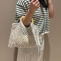 Sac à main vintage en crochet ajouré de luxe pour femme, sac de plage et de shopping en macramé fait main tendance pour l'été avec poignée en bois en forme de cœur