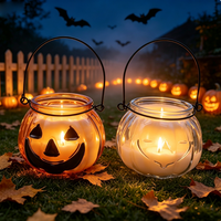 Pot à bougie en verre en forme de citrouille avec poignée en métal pour la décoration d'ambiance du festival d'Halloween