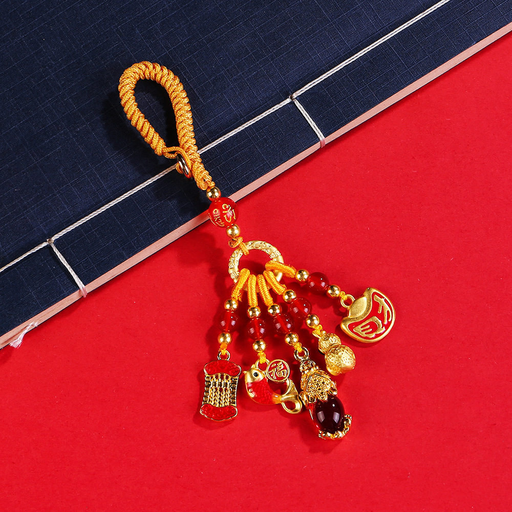Pendentif émail noeud porte-bonheur doré
