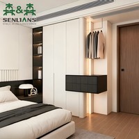 Armoire minimaliste sans poignées avec étagères ouvertes, armoire intégrée noir anthracite et portes à rainures cachées pour chambre à coucher