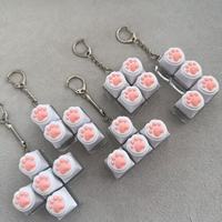 En gros, Porte-clés anti-stress en silicone Patte de chat, jouet à presser pour clavier mécanique, mignon et moelleux, breloque anti-stress pour usage quotidien