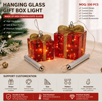 Lampe portable en forme de boîte cadeau de Noël, fournisseur de marque privée, ODM, guirlande lumineuse LED, décoration de fêtes, verre borosilicate rouge et or, vente en gros