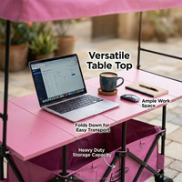 Chariot de camping pliable à quatre roues avec auvent réglable en hauteur, table intégrée, en acier rose/noir