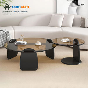 סט של 2 שולחנות קפה עגולים עם משטח זכוכית בצבע ענבר ובסיס עץ שחור לסלון - Product Image 1