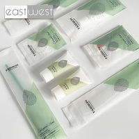 Kit d'articles de toilette pour hôtel, gel douche en tube jetable East West, logo personnalisé, économique, pochette en plastique souple, ensemble d'hygiène pour la chambre