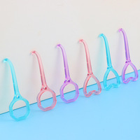 Consommables dentaires de crochet de dissolvant d'alignement en plastique transparent en forme de coeur