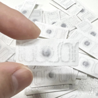 Etiquetas RFID inteligentes de alta calidad para ropa UHF ropa tela 860-960Mhz máquina de etiquetas de lavandería producida en masa para hoteles