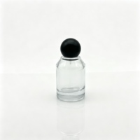 Flacon pulvérisateur de parfum en verre de luxe vide de 50 ml, rond, à épaule oblique, avec capuchon à bille noir
