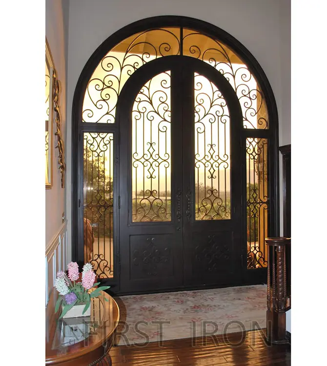 Full arch wrought iron double front door with transom and sidelights