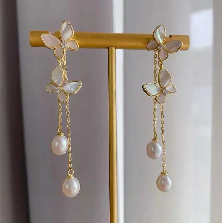 Classic new symmetrical fluttering butterfly tassel earrings, natural freshwater water droplets, pearls, long fairy earrings