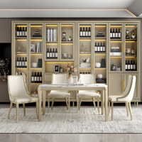 Table à manger en bois massif de luxe chinois moderne avec plateau en marbre et chaises dorées champagne, ensemble complet de la marque Han Yuan
