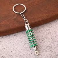 Mode Vintage Turbo Keychain Suspension en alliage de zinc en métal avec amortisseur imprimé UV pour les amateurs de voiture Mooding