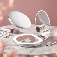 Miroir de poche compact LED personnalisé avec logo, double face grossissante, pliable, portable, avec lumière, idéal pour le maquillage et les voyages, cadeau promotionnel.