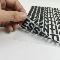 Étiquette en silicone 3D à l'aspect poli, technologie d'effet en relief 3D pour les articles promotionnels, conception de logo gratuite, autocollant pour vêtements