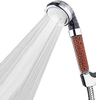Pommeau de douche ionique tenu dans la main Plastique d'ABS Filtré Caractéristique simple de massage de sortie d'eau pour des hôtels