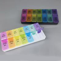Pilulier personnalisé 7 jours deux rangées 14 compartiments en plastique pilulier hebdomadaire couvercle de couleur arc-en-ciel