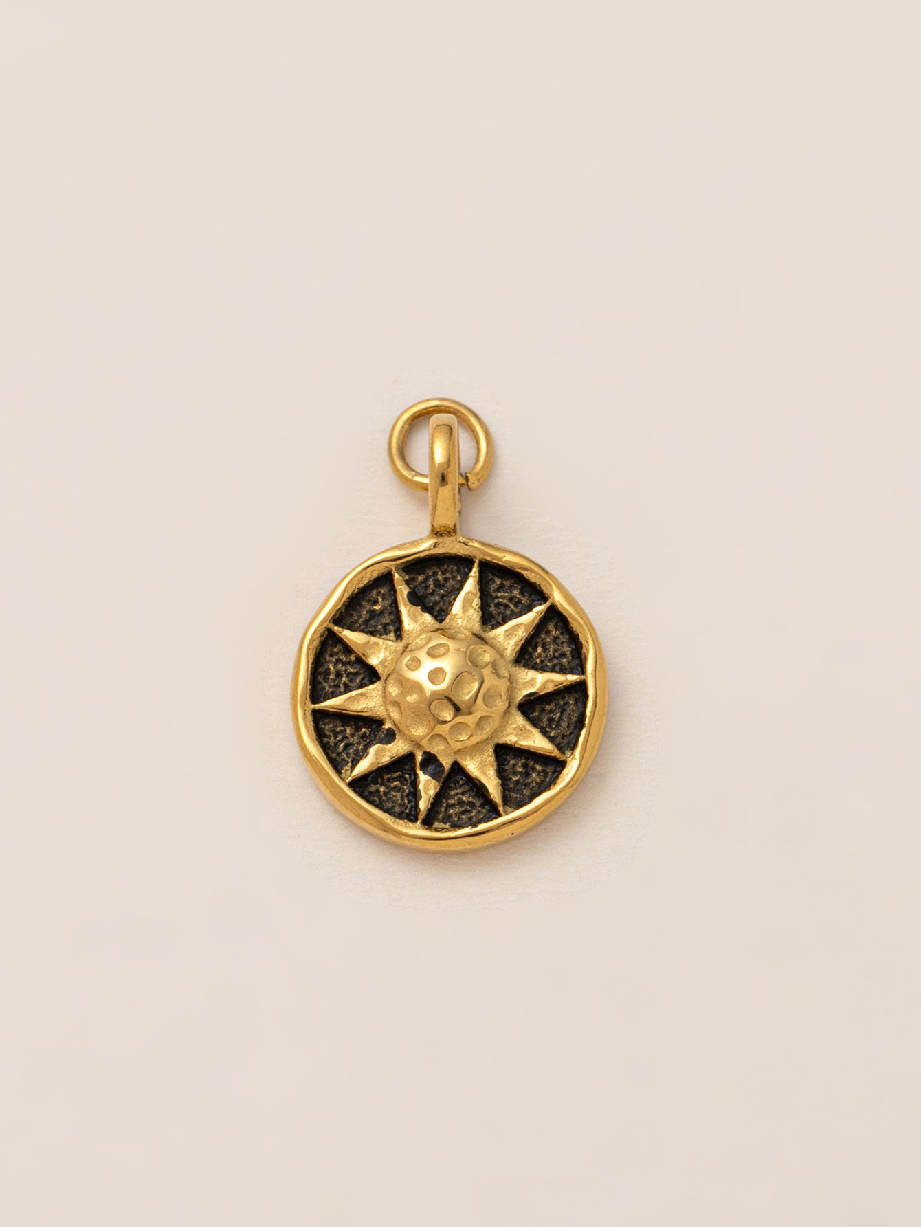 Pendentif soleil en bronze