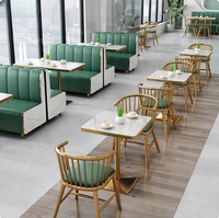 Ensemble de banquettes en cuir modernes très demandées, table et chaises durables à motif marbre pour restaurants, hôtels et cafés