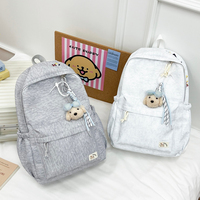 Sac à dos de voyage léger et polyvalent pour femmes et hommes, sac d'école confortable pour les trajets quotidiens avec pendentif ours en peluche