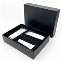 Boîte cadeau rigide noire de luxe avec insert en mousse EVA et logo personnalisé, emballage haut de gamme pour tubes de soins de la peau et ensembles cosmétiques