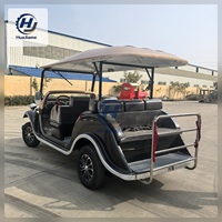 Voiturette de golf électrique noire et champagne au style vintage pour le transport dans les complexes hôteliers et l'hôtellerie