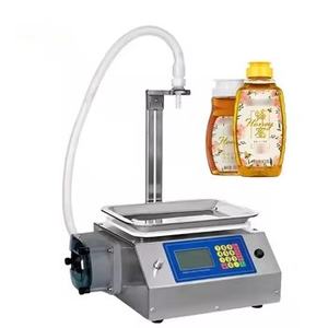 Machine de remplissage de bureau compacte pour miel et shampoing, semi-automatique, à commande PLC, haute précision pour flacons en verre et liquides à haute viscosité - Product Image 1