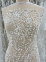 Tissu de dentelle de mariage blanc luxueux à sequins et perles