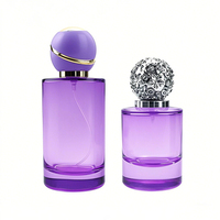 Flacon de parfum en verre cylindrique de luxe 50 ml 100 ml vide rond avec différents bouchons et vaporisateurs pour sérigraphie