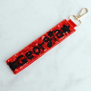 Porte-clés personnalisé rouge et noir pour le jour du match, avec perles de géorgie, sangle en perles de rocaille et pendentif à fermoir pivotant doré, vente en gros - Product Image 1