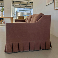 Canapé d'angle trois places en lin plissé, design français moderne et luxueux, confortable, avec pompons, pour la décoration intérieure d'hôtel
