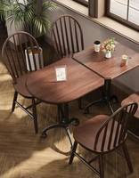 Table de restaurant classique en bois massif avec base décorative en fonte pour bar, bistrot, café