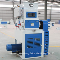 Décortiqueuse de riz automatique pneumatique à rouleaux en caoutchouc de bonne qualité pour usine de traitement du riz