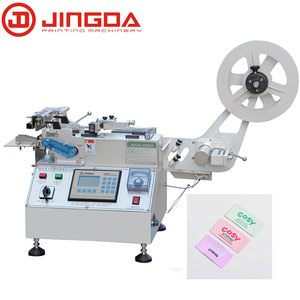 Máquina de corte de etiquetas de cinta satinada, 600 unidades por minuto, caliente y fría, para el cuidado de la ropa, etiquetas, cinta de algodón y tafetán de nailon - Product Image 1